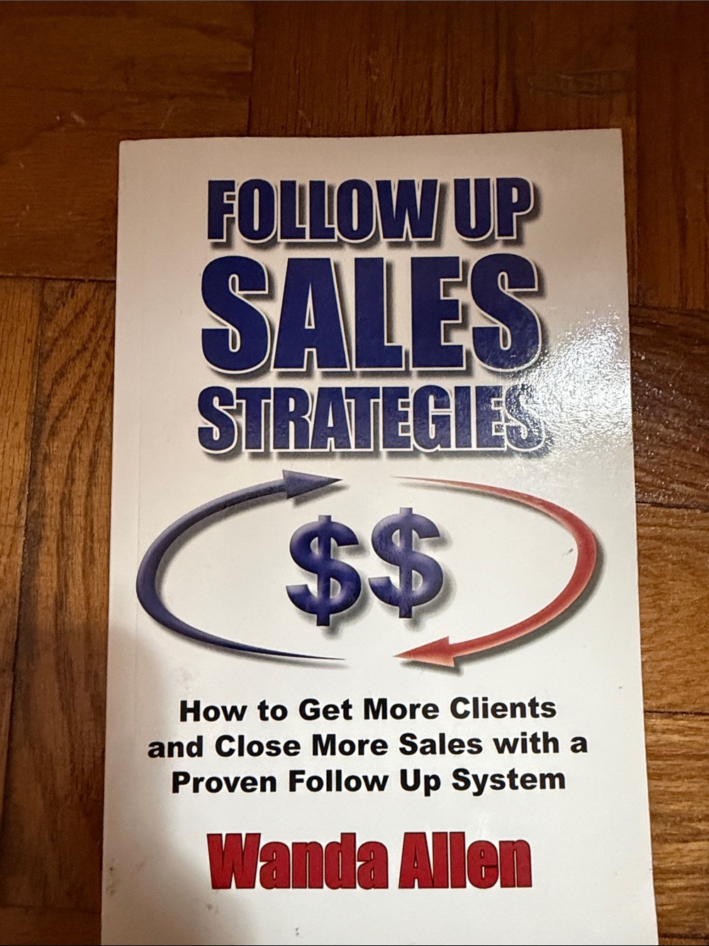 Follow Up Sales Strategies by Wanda Allen - White, Blue, Red Cover